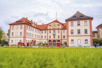 Historic castle with large lawn and sky in the background, Mainau flower island, Lake Constance,