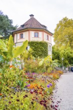 House with colourful flower bed in autumn garden, Mainau flower island, Lake Constance, Germany
