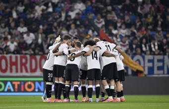 German national team team building, team circle in front of the start of the World Cup qualifier,