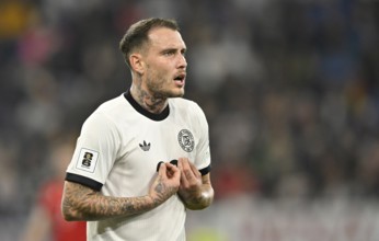 David Raum GER (22) mimes innocent lamb after foul gesture World Cup qualifier, international