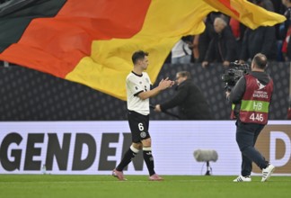 Joshua Kimmich GER (06) thanks fans after the match gesture gesture TV camera, national flag, flag,