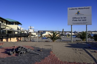 Sign at a building site on the waterfront, Robert Harbour, Lüderitz, Karas Region, Namibia
