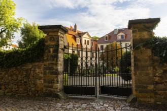 Iron gate on stone wall, Old Town, Meissen, Saxony, Germany