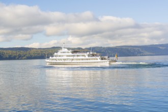 White ship sailing across a clear lake against a picturesque mountain backdrop, Überlingen, Lake