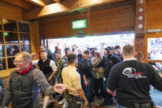 Crowd of people trying to get into the marquee, lively atmosphere, Cannstatter Wasen folk festival,