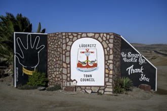 Sign at the entrance to the town, town coat of arms, Lüderitz, Karas region, Namibia