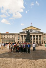 Japanese tourist group in front of the King Max I Joseph Monument. In the back National Theatre