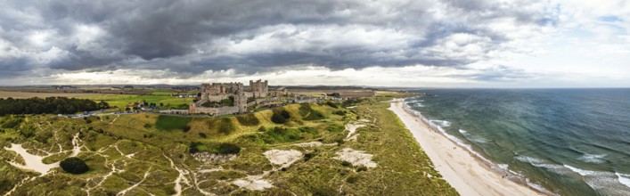 Panorama of Bamburgh Castle from a drone, Northumberland, Northeast Coast, England, United Kingdom