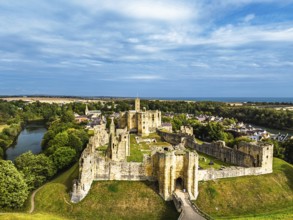 Warkworth Castle over River Coquet from a drone, Warkworth, Northumberland, England, United Kingdom