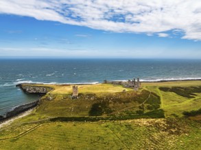 Dunstanburgh Castle from a drone, Northumberland Coast, England, United Kingdom