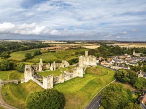 Warkworth Castle over River Coquet from a drone, Warkworth, Northumberland, England, United Kingdom
