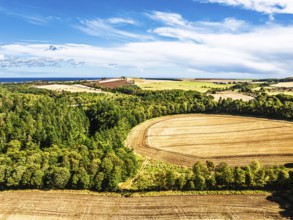 Farms and Fields over Ayton Castle from a drone, Ayton, Eyemouth, Scottish Borders, Scotland, UK