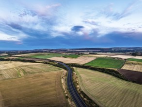 Sunset of Fields and Farms over Traprain Law and Hailes Castle from a drone, River Tyne,