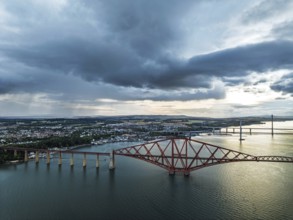 Rain clouds over Forth Bridge from a drone, Queensferry Crossing, Forth Estuary, Scotland, United