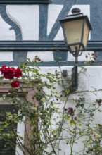 Street lamp on a historic half-timbered house, Eltville, Rheingau, Hesse, Germany
