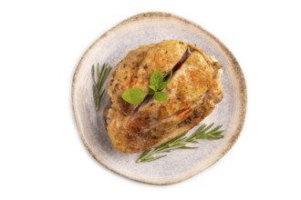 Fried Turkey Thigh with spices and rosemary on plate isolated on white background. top view, flat