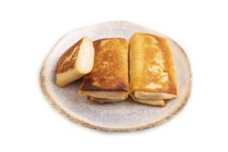 Fried crispy pancakes with meat and cheese isolated on white background. top view, flat lay, copy