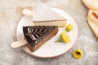 Chocolate and Vanilla Cake pops Marshmallow with cup of coffee on brown concrete background and