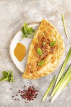 Fried homemade Khachapuri cake with cheese and meat, fried in pan. Traditional Georgian cuisine on