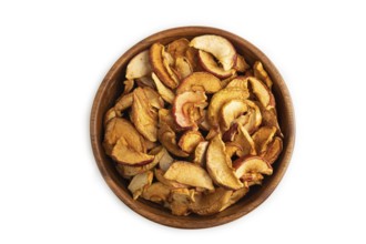 Dried Apples in wooden bowl isolated on white background. Top view, close up, flat lay. healthy
