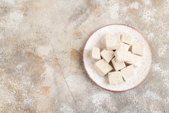 Coffee marshmallow on brown concrete background. top view, flat lay, copy space