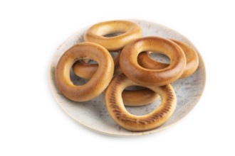 Homemade Ring Bagel isolated on white background. side view, close up