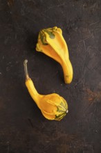 Two decorative orange Pumpkins on black concrete background, top view, flat lay, copy space,