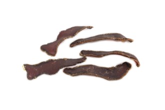 Armenian Basturma dried meat isolated on white background. Side view, flat lay