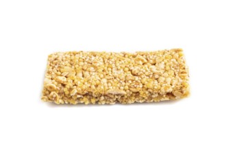 Granola bar with, caramel, nuts, flakes isolated on white background. Side view, close up