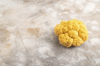 Yellow Cauliflower on brown concrete background. Side view, copy space. healthy food, vegetable,