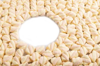 Round copy space on Orange and pink marshmallow background, side view, minimalism