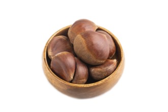 Wooden bowl with raw edible ?hestnuts Isolated on white background, side view, close up, minimalism