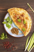 Fried homemade Khachapuri cake with cheese and meat, fried in pan. Traditional Georgian cuisine on