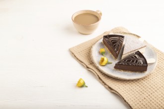 Chocolate and Vanilla Cake pops Marshmallow with cup of coffee on white wooden background and beige