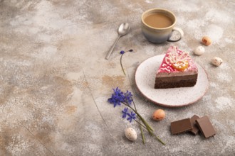 Chocolate cake on brown concrete background, cup of coffee, side view, copy space
