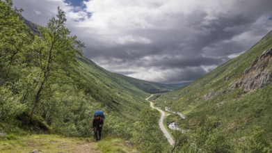 Pilgrims on the Kongevegen or King's Road, Olavsleden pilgrimage route, Drivdalen valley, ascent to