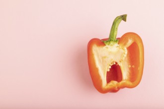 Red Cutted pepper on pink pastel background. Top view, flat lay, copy space. Tropical, healthy