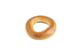 Homemade Ring Bagel isolated on white background. side view, close up