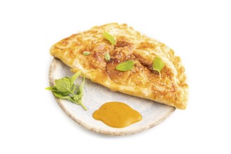 Fried homemade Khachapuri cake with cheese and meat, fried in pan. Traditional Georgian cuisine