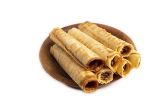 Waffles with caramel isolated on white background, side view, close up