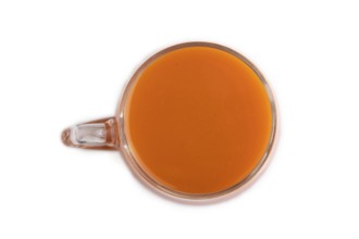 Two glasses with carrot juice isolated on white background. Diet, healthy eating concept. Top view,