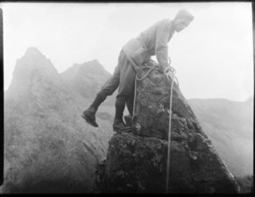 Male rock climber thought to be Cuillin mountains, Skye, Scotland, UK c 1900-1920