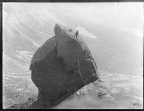 Climber with rope climbing The Cioch, The Cuillins, Isle of Skye, Scotland, UK c 1910-1920