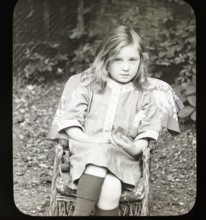Magic lantern slide c 1900-1910 halftone portrait of pretty young girl sitting in a chair