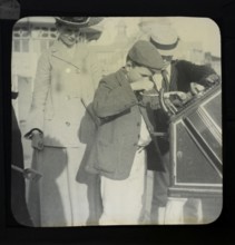 Magic lantern slide mother watching of two boys using a Roovers Metal Stamping Machine at the