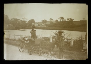 Magic lantern slide c 1900-1910 of children with a cart pulled along by a goat