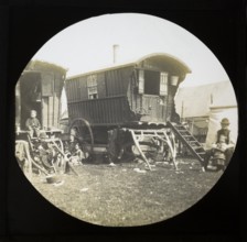 Magic lantern slide portrait of fairground travelling gypsies and caravans, UK circa 1900