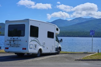 Motorhome in a car park overlooking a tranquil lake and mountains, Te Anau, Lake Te Anau, Southland