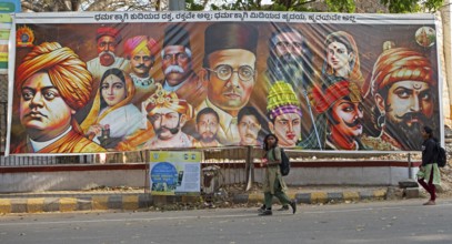 Street poster with the heads of religious fighters for Hinduism, Srirangapatna, Karnataka, India