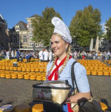Woman in traditional dress at a sunny cheese market, Cheese, Cheese market, Alkmaar, Alkmar,